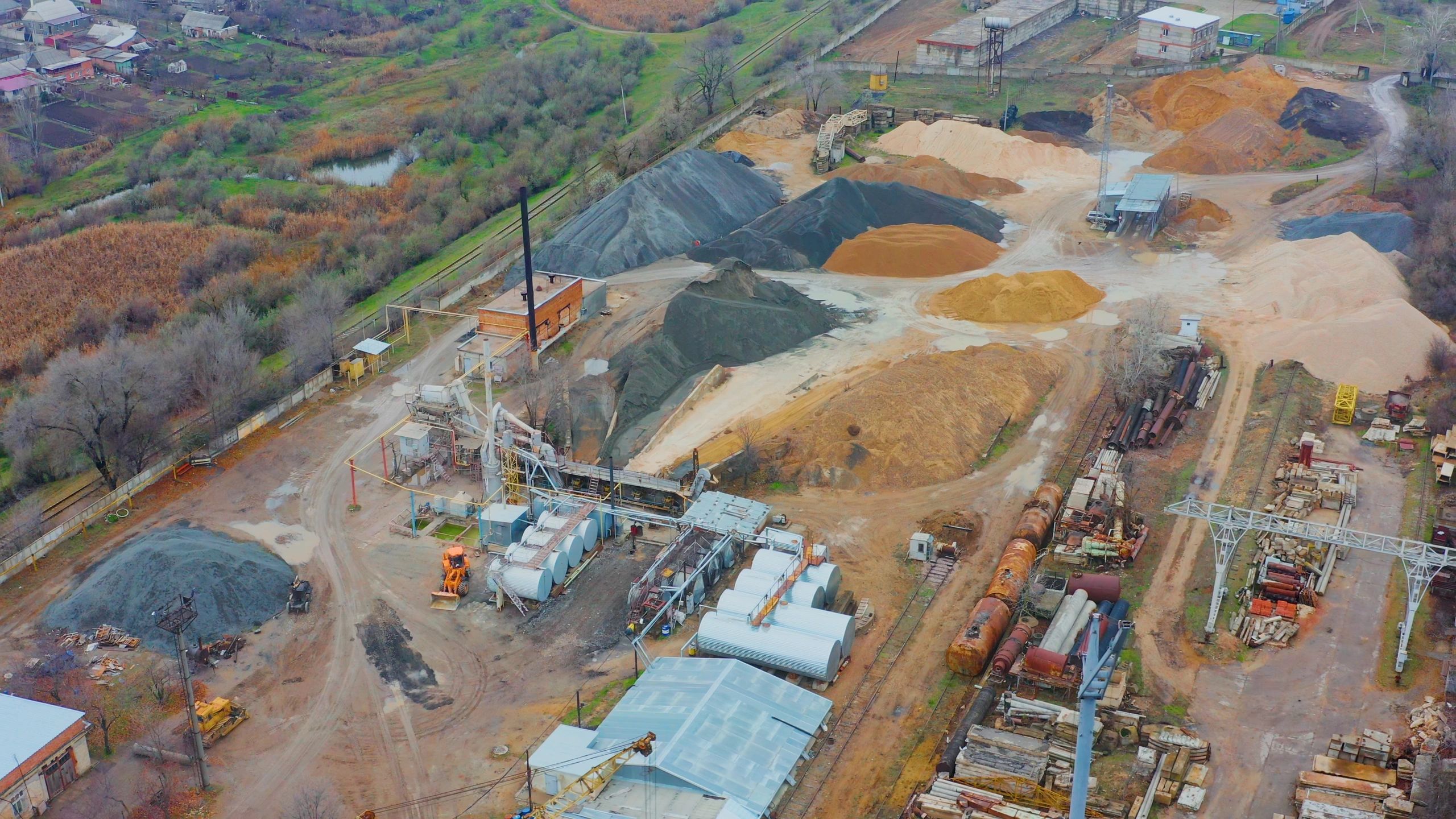 Aerial view of an industrial site and gravel quarry